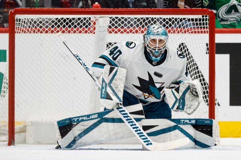 Mar 6, 2025; Denver, Colorado, USA; San Jose Sharks goaltender Alexandar Georgiev (40) watches the puck on a shot in the first period against the Colorado Avalanche at Ball Arena. Mandatory Credit: Isaiah J. Downing-Imagn Images