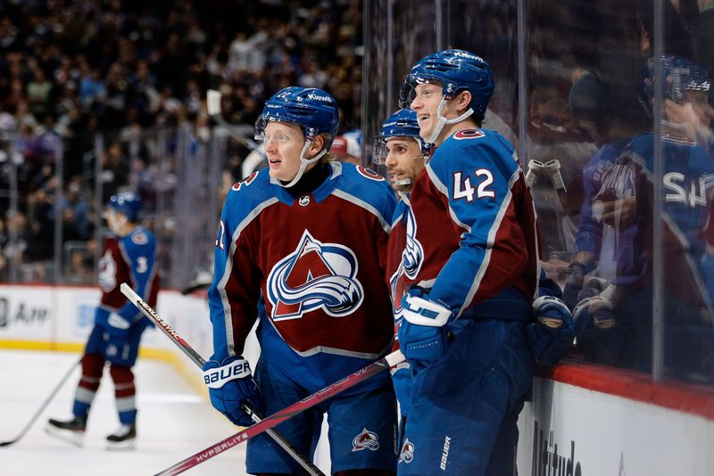 Jan 26, 2024; Denver, Colorado, USA; Colorado Avalanche defenseman Josh Manson (42) celebrates his goal with center Andrew Cogliano (11) and left wing Fredrik Olofsson (22) in the second period against the Los Angeles Kings at Ball Arena. Mandatory Credit: Isaiah J. Downing-USA TODAY Sports