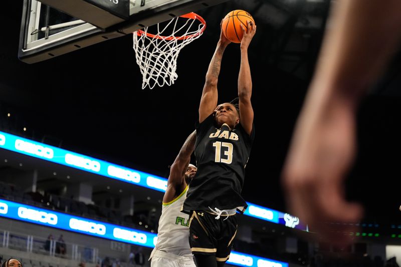 Mar 16, 2024; Fort Worth, TX, USA; UAB Blazers forward Christian Coleman (13) dunks the ball against South Florida Bulls guard Selton Miguel (1) during the second half at Dickies Arena. Mandatory Credit: Chris Jones-USA TODAY Sports