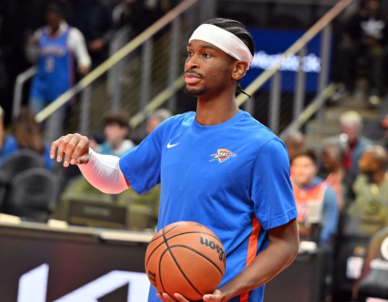 ATLANTA, GEORGIA - JANUARY 03: Shai Gilgeous-Alexander #2 of the Oklahoma City Thunder warms up before the game against the Atlanta Hawks on January 3, 2024 at State Farm Arena in Atlanta, Georgia. TO USER: User expressly acknowledges and agrees that, by downloading and or using this photograph, User is consenting to the terms and conditions of the Getty Images License Agreement.  (Photo by Paras Griffin/Getty Images)