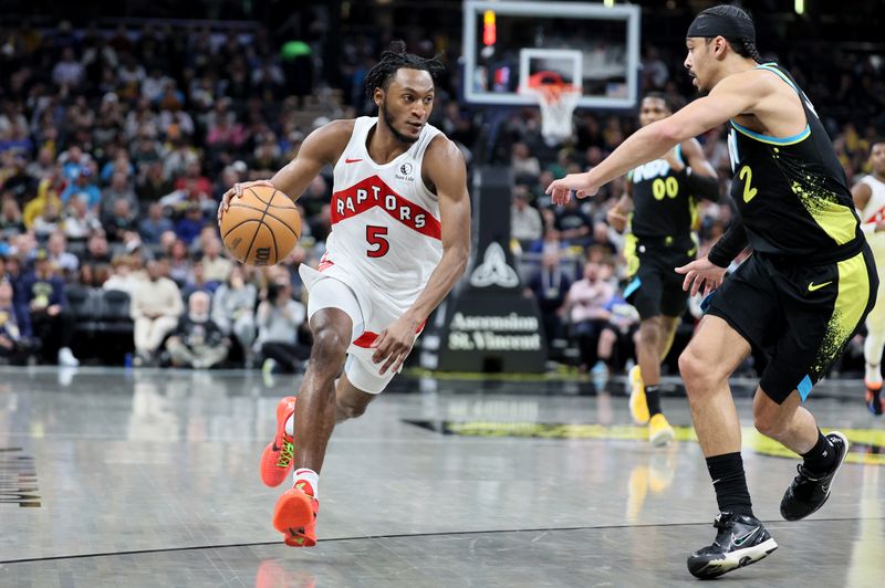 INDIANAPOLIS, INDIANA - FEBRUARY 26:   Immanuel Quickley #5 of the Toronto Raptors dribbles the ball against the Indiana Pacers at Gainbridge Fieldhouse on February 26, 2024 in Indianapolis, Indiana.    NOTE TO USER: User expressly acknowledges and agrees that, by downloading and or using this photograph, User is consenting to the terms and conditions of the Getty Images License Agreement.  (Photo by Andy Lyons/Getty Images)