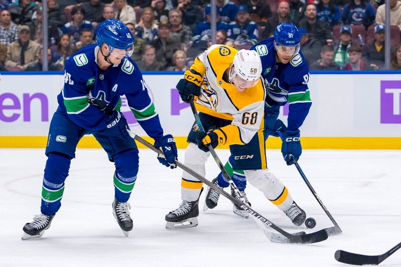 Nov 17, 2024; Vancouver, British Columbia, CAN; Vancouver Canucks forward Elias Pettersson (40) and forward Dakota Joshua (81) battle with Nashville Predators forward Zachary L'Heureux (68) during the third period at Rogers Arena. Mandatory Credit: Bob Frid-Imagn Images