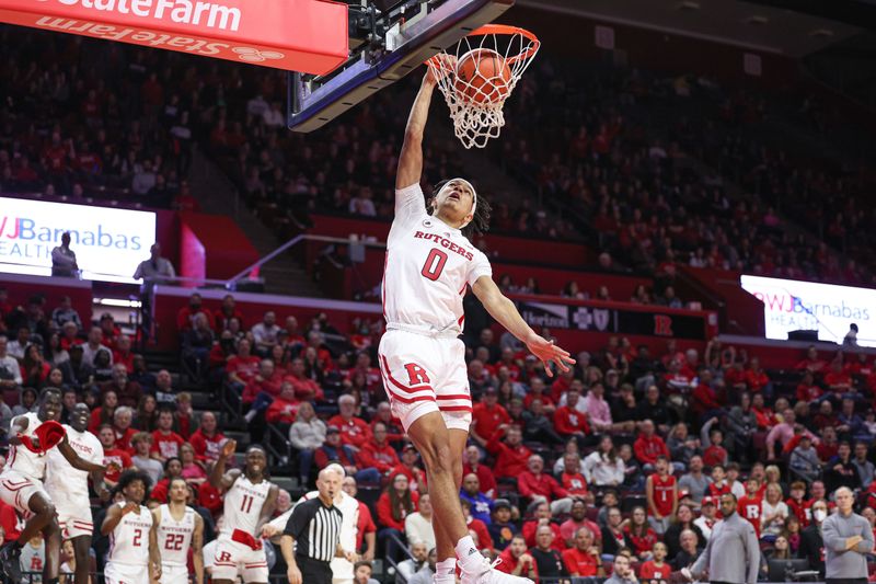 Nov 26, 2022; Piscataway, New Jersey, USA; Rutgers Scarlet Knights guard Derek Simpson (0) dunks during the second half against the Central Connecticut State Blue Devils at Jersey Mike's Arena. Mandatory Credit: Vincent Carchietta-USA TODAY Sports