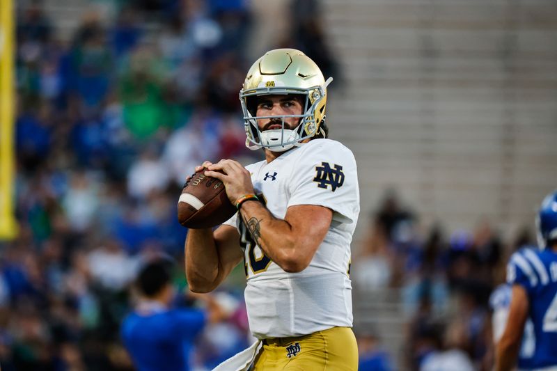 Sep 30, 2023; Durham, North Carolina, USA; Notre Dame Fighting Irish quarterback Sam Hartman (10) holds the football before the first half of the game against Duke Blue Devils at Wallace Wade Stadium. Mandatory Credit: Jaylynn Nash-USA TODAY Sports