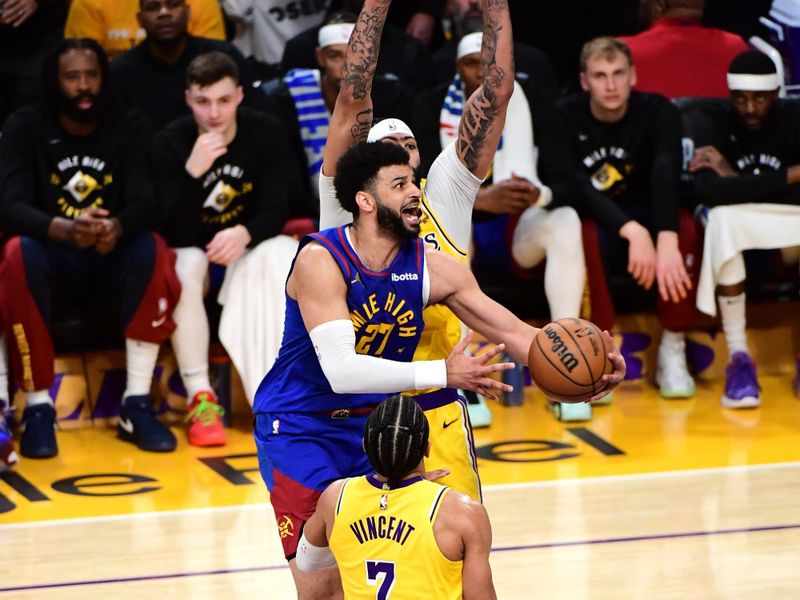 LOS ANGELES, CA - APRIL 25: Jamal Murray #27 of the Denver Nuggets drives to the basket during the game against the Los Angeles Lakers during Round One Game Three of the 2024 NBA Playoffs on April 25, 2024 at Crypto.Com Arena in Los Angeles, California. NOTE TO USER: User expressly acknowledges and agrees that, by downloading and/or using this Photograph, user is consenting to the terms and conditions of the Getty Images License Agreement. Mandatory Copyright Notice: Copyright 2024 NBAE (Photo by Adam Pantozzi/NBAE via Getty Images)