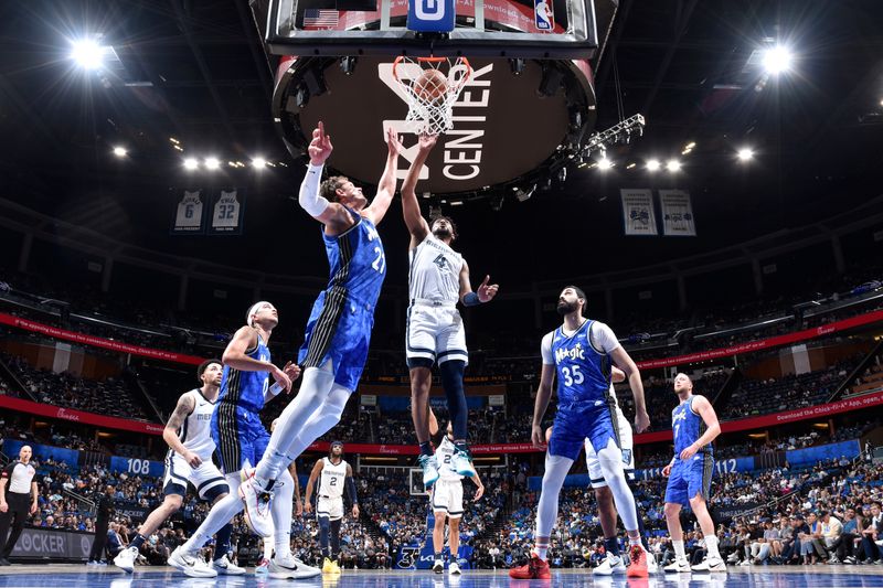 ORLANDO, FL - MARCH 30: Jordan Goodwin #4 of the Memphis Grizzlies drives to the basket during the game against the Orlando Magic on March 30, 2024 at the Kia Center in Orlando, Florida. NOTE TO USER: User expressly acknowledges and agrees that, by downloading and or using this photograph, User is consenting to the terms and conditions of the Getty Images License Agreement. Mandatory Copyright Notice: Copyright 2024 NBAE (Photo by Fernando Medina/NBAE via Getty Images)