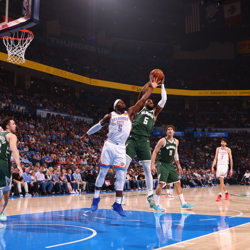 OKLAHOMA CITY, OK - APRIL 12: Malik Beasley #5 of the Milwaukee Bucks goes up for the rebound during the game against the Oklahoma City Thunder on April 12, 2024 at Paycom Arena in Oklahoma City, Oklahoma. NOTE TO USER: User expressly acknowledges and agrees that, by downloading and or using this photograph, User is consenting to the terms and conditions of the Getty Images License Agreement. Mandatory Copyright Notice: Copyright 2024 NBAE (Photo by Zach Beeker/NBAE via Getty Images)