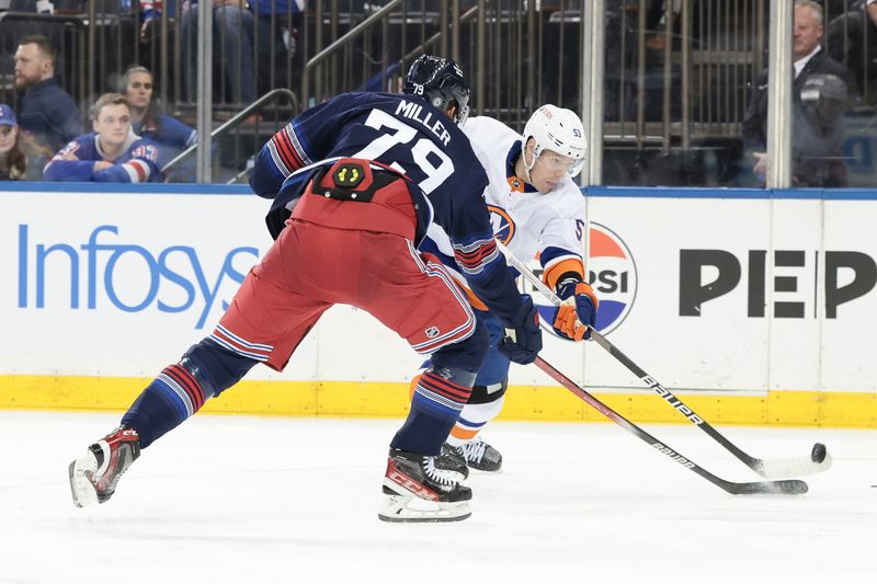 Mar 17, 2024; New York, New York, USA; New York Islanders center Casey Cizikas (53) shoots the puck as New York Rangers defenseman K'Andre Miller (79) defends during the second period at Madison Square Garden. Mandatory Credit: Vincent Carchietta-USA TODAY Sports