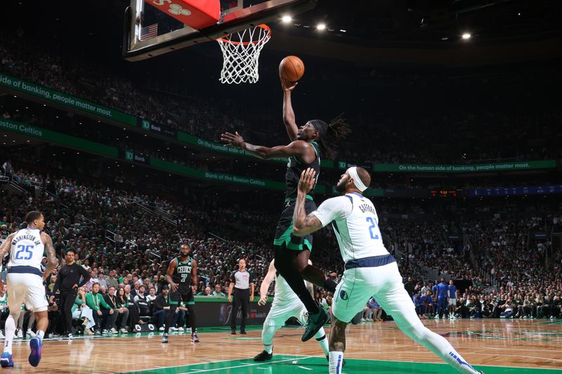 BOSTON, MA - JUNE 9: Jrue Holiday #4 of the Boston Celtics drives to the basket during the game against the Dallas Mavericks during Game 1 of the 2024 NBA Finals on June 9, 2024 at the TD Garden in Boston, Massachusetts. NOTE TO USER: User expressly acknowledges and agrees that, by downloading and or using this photograph, User is consenting to the terms and conditions of the Getty Images License Agreement. Mandatory Copyright Notice: Copyright 2024 NBAE  (Photo by Nathaniel S. Butler/NBAE via Getty Images)