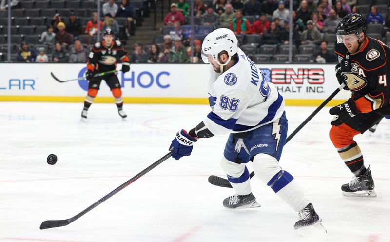 Mar 24, 2024; Anaheim, California, USA; Tampa Bay Lightning right wing Nikita Kucherov (86) passes from Anaheim Ducks defenseman Cam Fowler (4) during the first period at Honda Center. Mandatory Credit: Jason Parkhurst-USA TODAY Sports