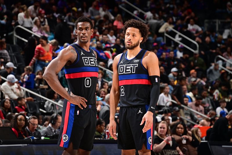 DETROIT, MI - MARCH 15: Jalen Duren #0 of the Detroit Pistons and Cade Cunningham #2 of the Detroit Pistons talk during the game against the Miami Heat on March 15, 2024 at Little Caesars Arena in Detroit, Michigan. NOTE TO USER: User expressly acknowledges and agrees that, by downloading and/or using this photograph, User is consenting to the terms and conditions of the Getty Images License Agreement. Mandatory Copyright Notice: Copyright 2024 NBAE (Photo by Chris Schwegler/NBAE via Getty Images)