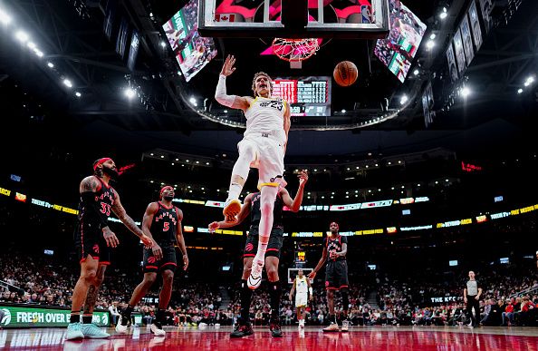 TORONTO, ON - DECEMBER 23: Lauri Markkanen #23 of the Utah Jazz dunks against the Toronto Raptors during the first half of their basketball game at the Scotiabank Arena on December 23, 2023 in Toronto, Ontario, Canada. NOTE TO USER: User expressly acknowledges and agrees that, by downloading and/or using this Photograph, user is consenting to the terms and conditions of the Getty Images License Agreement. (Photo by Mark Blinch/Getty Images)