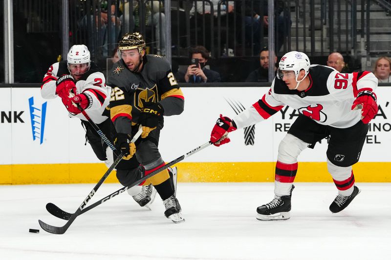 Mar 17, 2024; Las Vegas, Nevada, USA; Vegas Golden Knights right wing Michael Amadio (22) skates between New Jersey Devils defenseman Brendan Smith (2) and New Jersey Devils left wing Tomas Nosek (92) during the first period at T-Mobile Arena. Mandatory Credit: Stephen R. Sylvanie-USA TODAY Sports