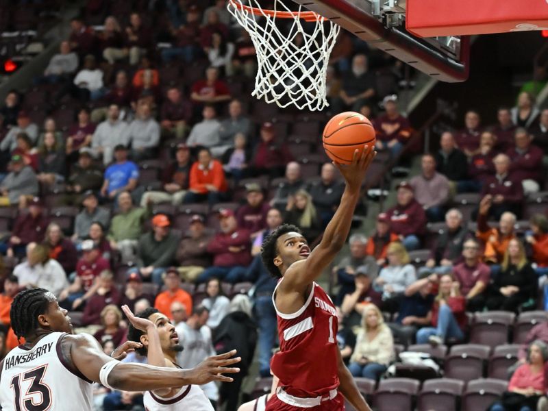 Jan 7, 2026; Blacksburg, Virginia, USA;  Stanford Cardinal guard Ebuka Okorie (1) lays the ball up as Virginia Tech Hokies guard Jailen Bedford (0) defends during the second half at Cassell Coliseum. Mandatory Credit: Brian Bishop-Imagn Images