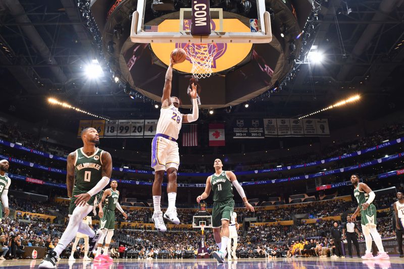 LOS ANGELES, CA - OCTOBER 15:  Rui Hachimura #28 of the Los Angeles Lakers drives to the basket during the game against the Milwaukee Bucks on October 15, 2023 at Crypto.Com Arena in Los Angeles, California. NOTE TO USER: User expressly acknowledges and agrees that, by downloading and/or using this Photograph, user is consenting to the terms and conditions of the Getty Images License Agreement. Mandatory Copyright Notice: Copyright 2023 NBAE (Photo by Adam Pantozzi/NBAE via Getty Images)