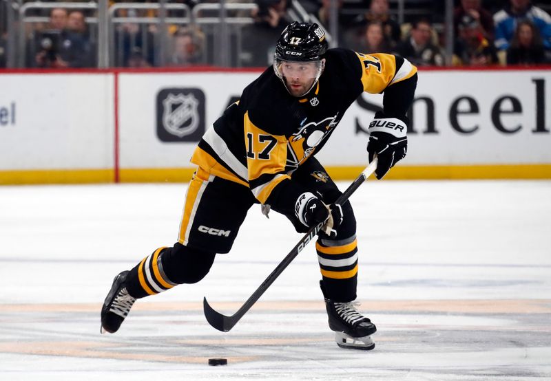 Jan 6, 2024; Pittsburgh, Pennsylvania, USA;  Pittsburgh Penguins right wing Bryan Rust (17) skates with the puck against the Buffalo Sabres during the third period at PPG Paints Arena. Buffalo won 3-1. Mandatory Credit: Charles LeClaire-USA TODAY Sports