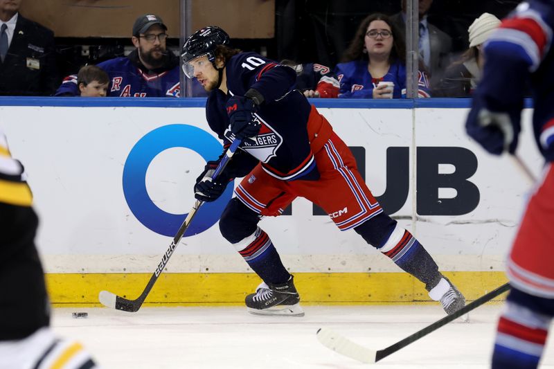 Dec 6, 2024; New York, New York, USA; New York Rangers left wing Artemi Panarin (10) controls the puck against the Pittsburgh Penguins during the third period at Madison Square Garden. Mandatory Credit: Brad Penner-Imagn Images