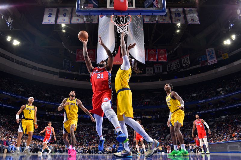 PHILADELPHIA, PA - DECEMBER 13: Joel Embiid #21 of the Philadelphia 76ers drives to the basket during the game against the Indiana Pacers on December 13, 2024 at the Wells Fargo Center in Philadelphia, Pennsylvania NOTE TO USER: User expressly acknowledges and agrees that, by downloading and/or using this Photograph, user is consenting to the terms and conditions of the Getty Images License Agreement. Mandatory Copyright Notice: Copyright 2024 NBAE (Photo by Jesse D. Garrabrant/NBAE via Getty Images)