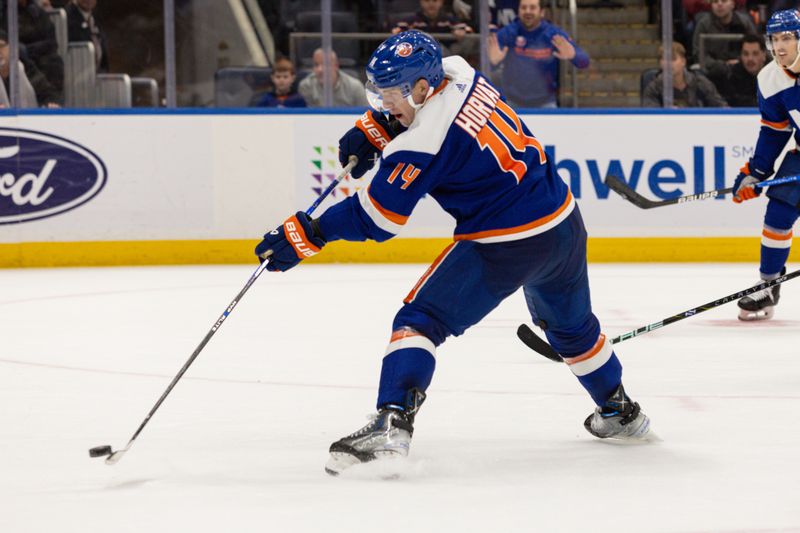 Nov 25, 2023; Elmont, New York, USA; New York Islanders center Bo Horvat (14) takes a shot against the Philadelphia Flyers during overtime at UBS Arena. Mandatory Credit: Thomas Salus-USA TODAY Sports