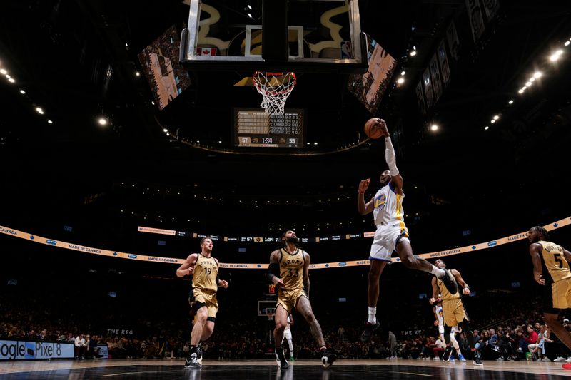 TORONTO, CANADA - MARCH 1:  Jonathan Kuminga #00 of the Golden State Warriors goes to the basket during the game on March 1, 2024 at the Scotiabank Arena in Toronto, Ontario, Canada.  NOTE TO USER: User expressly acknowledges and agrees that, by downloading and or using this Photograph, user is consenting to the terms and conditions of the Getty Images License Agreement.  Mandatory Copyright Notice: Copyright 2024 NBAE (Photo by Mark Blinch/NBAE via Getty Images)