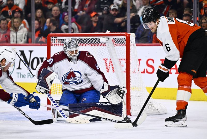 Jan 20, 2024; Philadelphia, Pennsylvania, USA; Colorado Avalanche goalie Alexandar Georgiev (40) defends the net as Philadelphia Flyers defenseman Travis Sanheim (6) reaches for the puck in the second period at Wells Fargo Center. Mandatory Credit: Kyle Ross-USA TODAY Sports