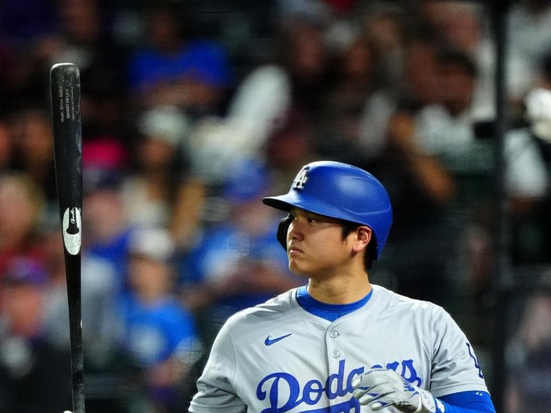 Sep 28, 2024; Denver, Colorado, USA; Los Angeles Dodgers designated hitter Shohei Ohtani (17) on deck in the ninth inning against the Colorado Rockies at Coors Field. Mandatory Credit: Ron Chenoy-Imagn Images