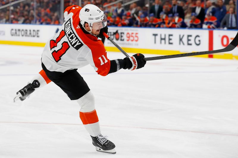 Oct 15, 2024; Edmonton, Alberta, CAN; Philadelphia Flyers forward Travis Konecny (11) breaks his stick while taking a shot against the Edmonton Oilers at Rogers Place. Mandatory Credit: Perry Nelson-Imagn Images