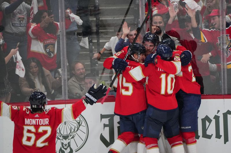 Jun 10, 2024; Sunrise, Florida, USA; Florida Panthers defenseman Niko Mikkola (77) celebrates scoring against the Edmonton Oilers during the second period in game two of the 2024 Stanley Cup Final at Amerant Bank Arena. Mandatory Credit: Jim Rassol-USA TODAY Sports