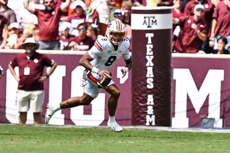 Sep 23, 2023; College Station, Texas, USA; Auburn Tigers quarterback Robby Ashford (9) runs the ball during the third quarter against the Texas A&M Aggies at Kyle Field. Mandatory Credit: Maria Lysaker-USA TODAY Sports