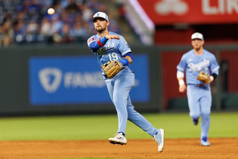 Sep 20, 2025; Kansas City, Missouri, USA; Kansas City Royals second base Michael Massey (19) throws to first base during the sixth inning against the Toronto Blue Jays at Kauffman Stadium. Mandatory Credit: William Purnell-Imagn Images