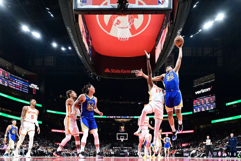 ATLANTA, GA - FEBRUARY 3: Trayce Jackson-Davis #32 of the Golden State Warriors  drives to the basket during the game  against the Atlanta Hawks on February 3, 2024 at State Farm Arena in Atlanta, Georgia.  NOTE TO USER: User expressly acknowledges and agrees that, by downloading and/or using this Photograph, user is consenting to the terms and conditions of the Getty Images License Agreement. Mandatory Copyright Notice: Copyright 2024 NBAE (Photo by Adam Hagy/NBAE via Getty Images)