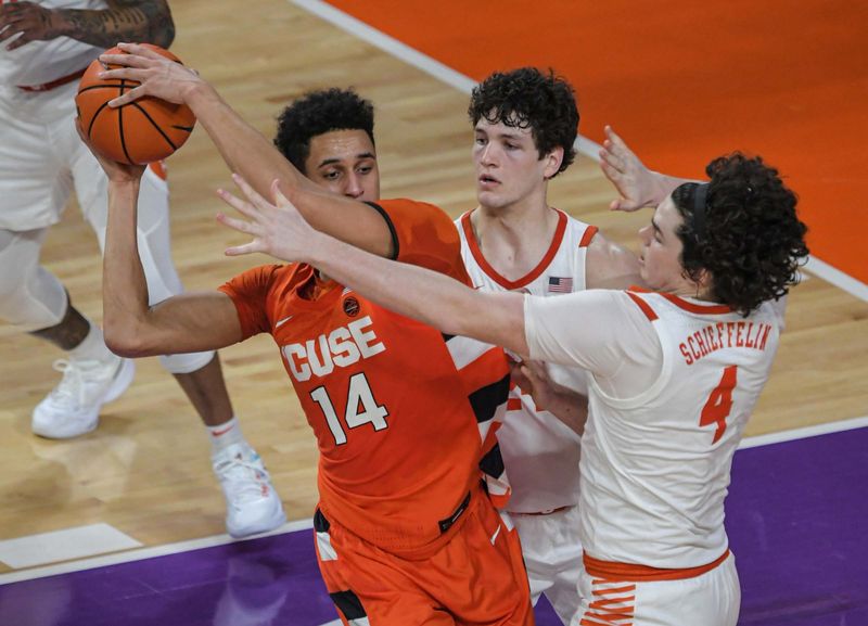 Feb 22, 2023; Clemson, South Carolina, USA; Clemson senior guard Devin Foster (14) looks to get around Clemson sophomore forward Ian Schieffelin (4) during the first half at Littlejohn Coliseum. Mandatory Credit: Ken Ruinard-USA TODAY Sports