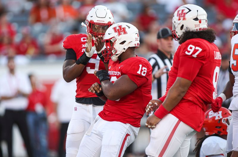 Sep 23, 2023; Houston, Texas, USA; Houston Cougars defensive lineman Anthony Holmes Jr. (18) reacts after a defensive play during the first quarter against the Sam Houston State Bearkats at TDECU Stadium. Mandatory Credit: Troy Taormina-USA TODAY Sports