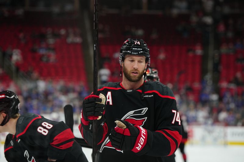 Nov 27, 2024; Raleigh, North Carolina, USA;  Carolina Hurricanes defenseman Jaccob Slavin (74) looks on during the warmups before the game against the New York Rangers at Lenovo Center. Mandatory Credit: James Guillory-Imagn Images