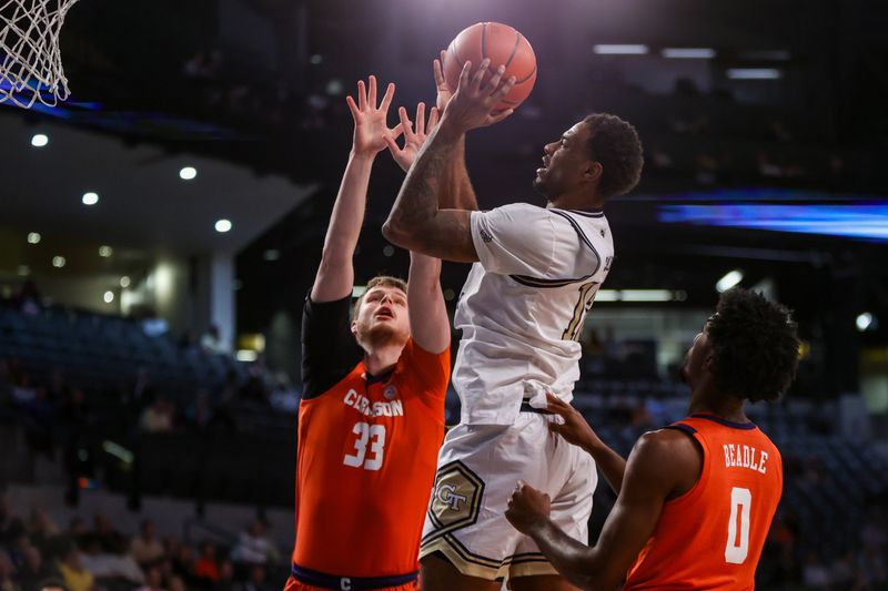 Feb 21, 2024; Atlanta, Georgia, USA; Georgia Tech Yellow Jackets forward Tyzhaun Claude (12) shoots against the Clemson Tigers in the second half at McCamish Pavilion. Mandatory Credit: Brett Davis-USA TODAY Sports