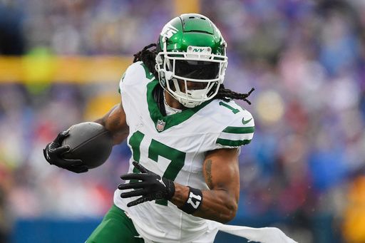 FILE - New York Jets wide receiver Davante Adams (17) runs with the ball during the second half of an NFL football game against the Buffalo Bills in Orchard Park, N.Y., Sunday, Dec. 29, 2024. (AP Photo/Adrian Kraus, File)