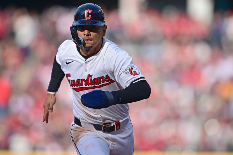 Apr 8, 2024; Cleveland, Ohio, USA; Cleveland Guardians second baseman Andres Gimenez (0) scores a run during the third inning against the Chicago White Sox at Progressive Field. Mandatory Credit: David Dermer-USA TODAY Sports