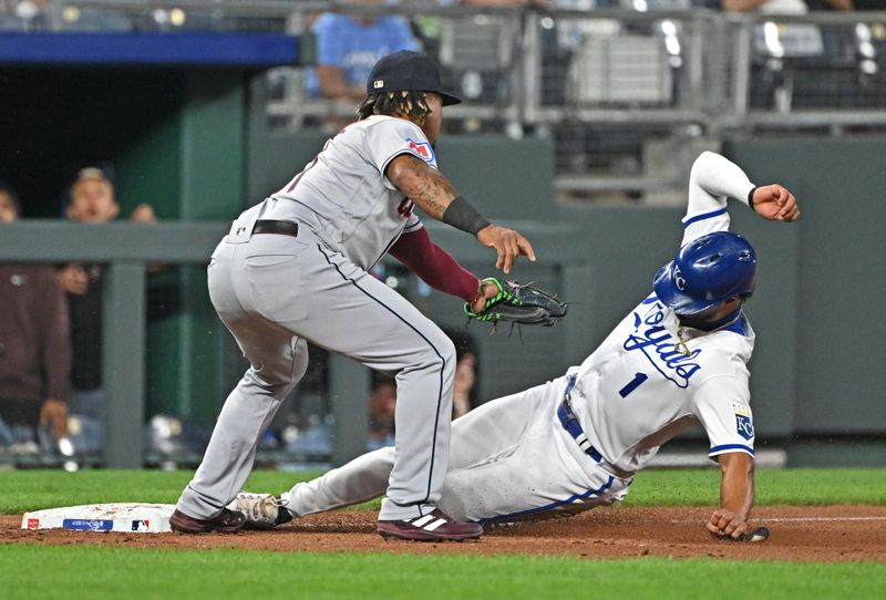 Sep 19, 2023; Kansas City, Missouri, USA; Kansas City Royals left fielder MJ Melendez (1) slides into third base safely against Cleveland Guardians third baseman Jose Ramirez (11) in the third inning at Kauffman Stadium. Mandatory Credit: Peter Aiken-USA TODAY Sports