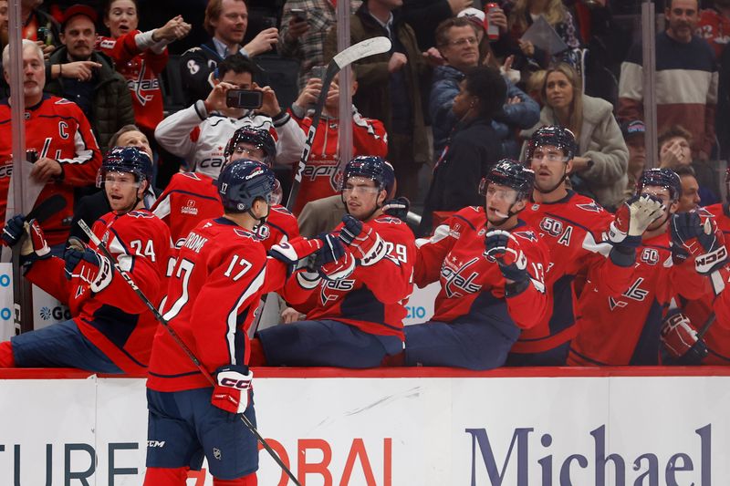 Nov 13, 2024; Washington, District of Columbia, USA; Washington Capitals center Dylan Strome (17) celebrates with teammates after scoring a goal against the Toronto Maple Leafs in the first period at Capital One Arena. Mandatory Credit: Geoff Burke-Imagn Images