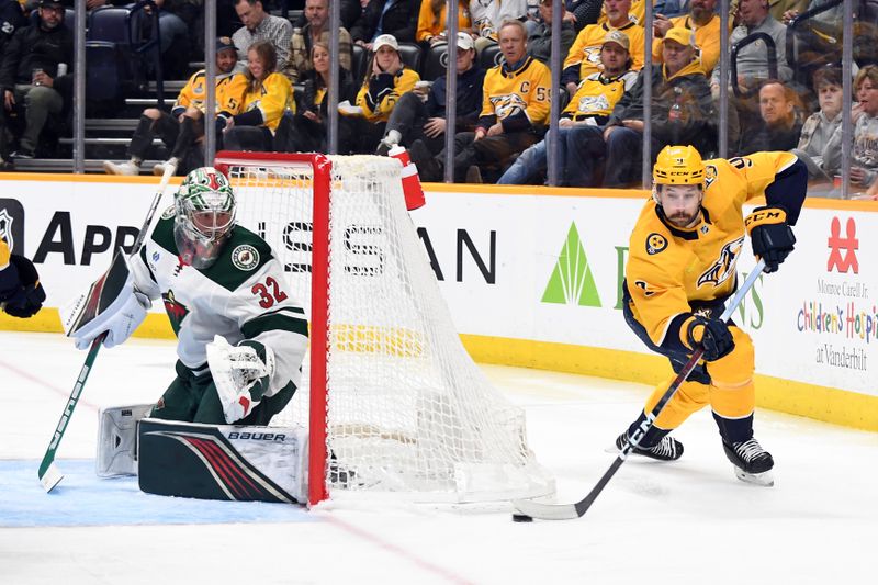 Feb 29, 2024; Nashville, Tennessee, USA; Nashville Predators left wing Filip Forsberg (9) attempts a wrap around against Minnesota Wild goaltender Filip Gustavsson (32) during the third period at Bridgestone Arena. Mandatory Credit: Christopher Hanewinckel-USA TODAY Sports