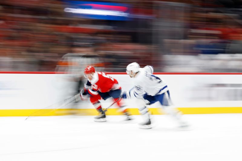 Nov 28, 2025; Washington, District of Columbia, USA; Washington Capitals center Ethen Frank (53) and Toronto Maple Leafs left wing Nicholas Robertson (89) chase the puck during the second period at Capital One Arena. Mandatory Credit: Geoff Burke-Imagn Images