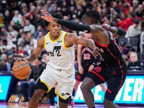 TORONTO, ON - DECEMBER 23: Collin Sexton #2 of the Utah Jazz drives against Dennis Schroder #17 of the Toronto Raptors during the second half of their basketball game at the Scotiabank Arena on December 23, 2023 in Toronto, Ontario, Canada. NOTE TO USER: User expressly acknowledges and agrees that, by downloading and/or using this Photograph, user is consenting to the terms and conditions of the Getty Images License Agreement. (Photo by Mark Blinch/Getty Images)