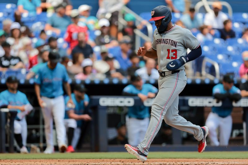Apr 13, 2025; Miami, Florida, USA; Washington Nationals second baseman Amed Rosario (13) scores after an RBI single by shortstop Paul DeJong (not pictured) during the fourth inning at loanDepot Park. Mandatory Credit: Sam Navarro-Imagn Images