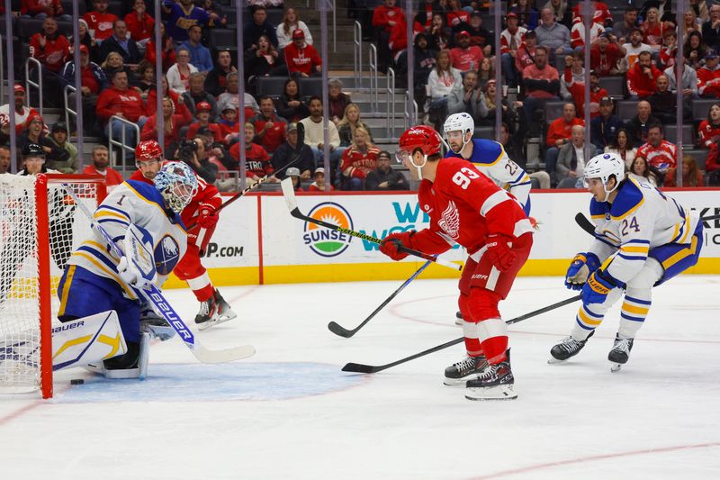 Nov 2, 2024; Detroit, Michigan, USA; Detroit Red Wings center Dylan Larkin (71) scores a goal on Buffalo Sabres goaltender Ukko-Pekka Luukkonen (1) in the second period at Little Caesars Arena. Mandatory Credit: Brian Bradshaw Sevald-Imagn Images