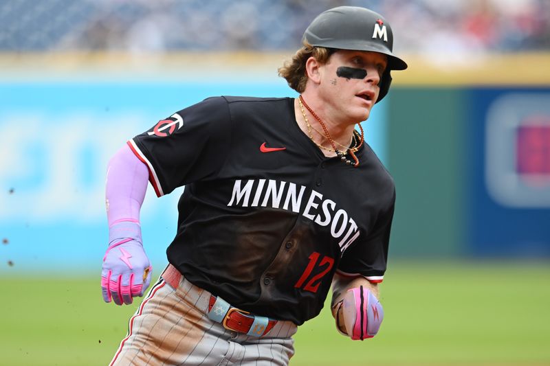 May 1, 2025; Cleveland, Ohio, USA; Minnesota Twins left fielder Harrison Bader (12) rounds third base en route to scoring during the seventh inning against the Cleveland Guardians at Progressive Field. Mandatory Credit: Ken Blaze-Imagn Images

