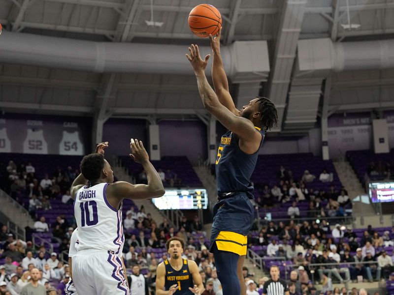 Jan 31, 2023; Fort Worth, Texas, USA; West Virginia Mountaineers guard Joe Toussaint (5) scores a basket over TCU Horned Frogs guard Damion Baugh (10) during the second half at Ed and Rae Schollmaier Arena. Mandatory Credit: Chris Jones-USA TODAY Sports