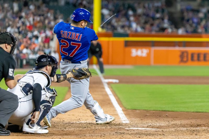 Aug 22, 2023; Detroit, Michigan, USA; Chicago Cubs right fielder Seiya Suzuki (27) hits a broken bat single in the eighth inning against the Detroit Tigers at Comerica Park. Mandatory Credit: David Reginek-USA TODAY Sports