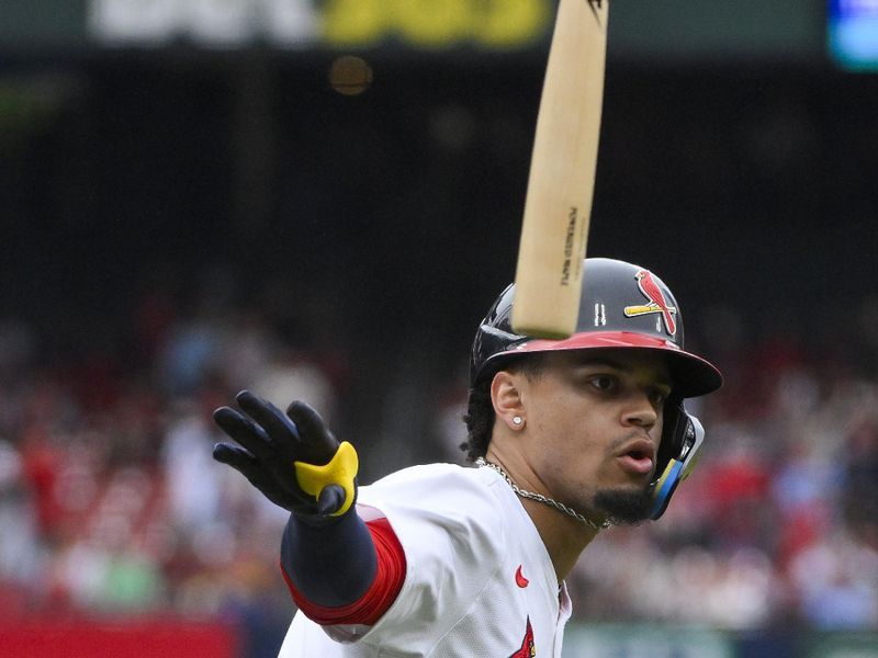 May 25, 2025; St. Louis, Missouri, USA;  St. Louis Cardinals shortstop Masyn Winn (0) flips his bat after hitting a solo home run against the Arizona Diamondbacks during the third inning at Busch Stadium. Mandatory Credit: Jeff Curry-Imagn Images