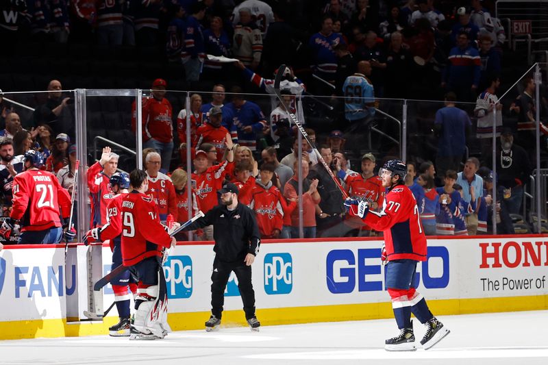 Apr 28, 2024; Washington, District of Columbia, USA; Washington Capitals right wing T.J. Oshie (77) salutes the fans before leaving the ice after the Capitals' game against the New York Rangers in game four of the first round of the 2024 Stanley Cup Playoffs at Capital One Arena. Mandatory Credit: Geoff Burke-USA TODAY Sports