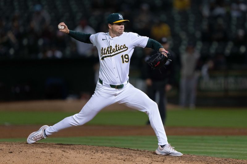 Jun 21, 2024; Oakland, California, USA; Oakland Athletics pitcher Mason Miller (19) pitches against the Minnesota Twins during the ninth inning at Oakland-Alameda County Coliseum. Mandatory Credit: Stan Szeto-USA TODAY Sports